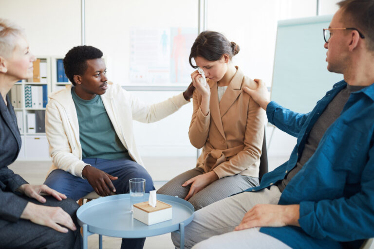 Crying Young Woman in Support Group | WellCheck
